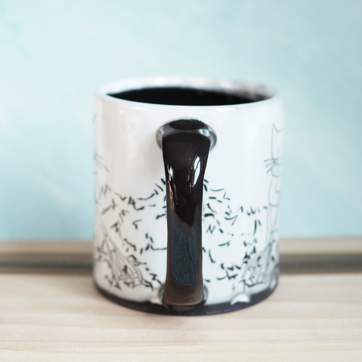 Black & White Cats Raking Leaves Mug